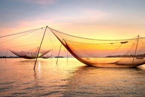 Fort Kochi Chinese fishing nets at sunset — Kerala travel guide 2026 best view