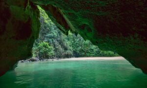 Hidden lagoon inside Emerald Cave (Tham Morakot) on Ko Mook, Thailand