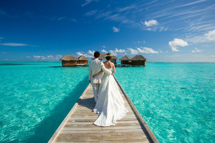 maldives couple walking beach ocean