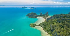 Aerial view of hidden island in Thailand with turquoise water and white sand beach